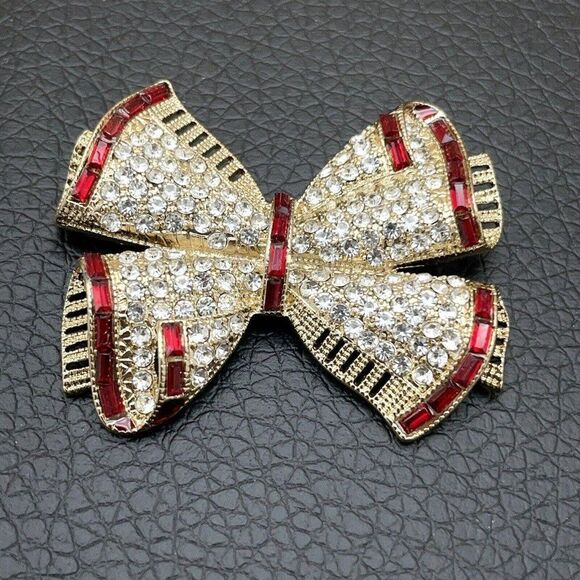 Napier Jewelry - Napier Brooch Holiday Bow Gold Tone Clear Round Rhinestones Red Baguettes 3D